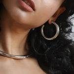 Silver hoop earrings and choker.
