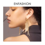 Sparkling gold tassel earrings.
