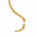 Gold snake-shaped earring.
