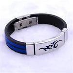 Black and blue rubber bracelet with silver clasp and tribal design.