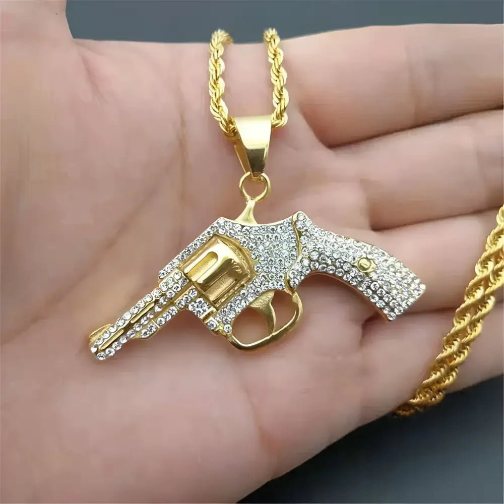 Gold revolver pendant necklace.