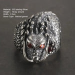 Silver dragon ring with garnet eyes.