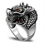 Silver dragon ring with red gems.