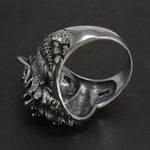 Silver wolf head ring.