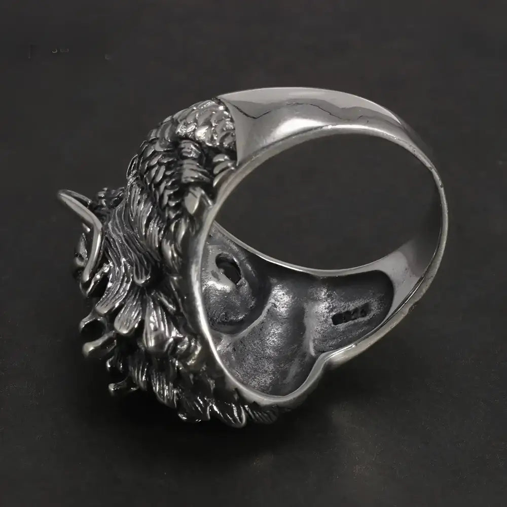 Silver wolf head ring.