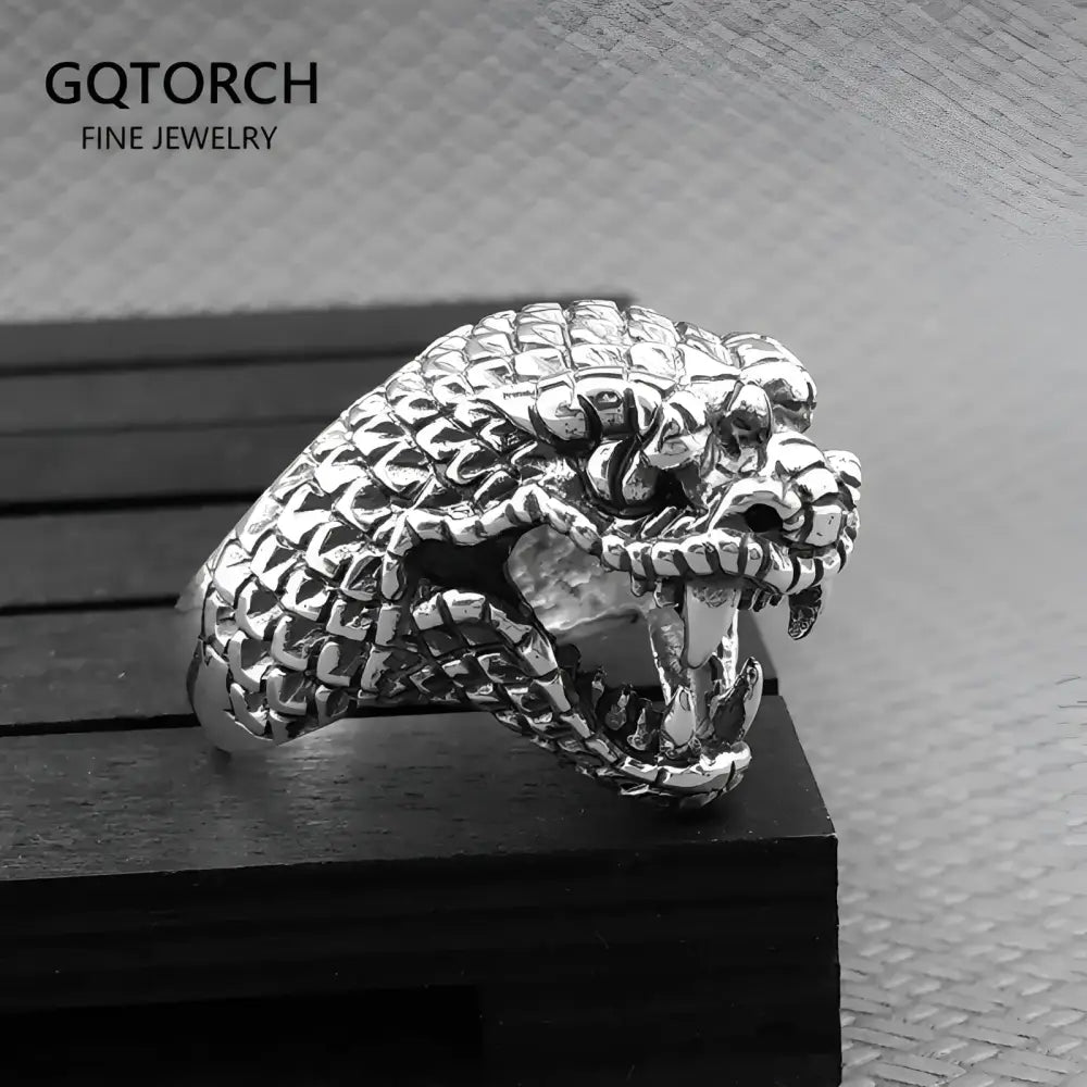 Silver snake head ring.
