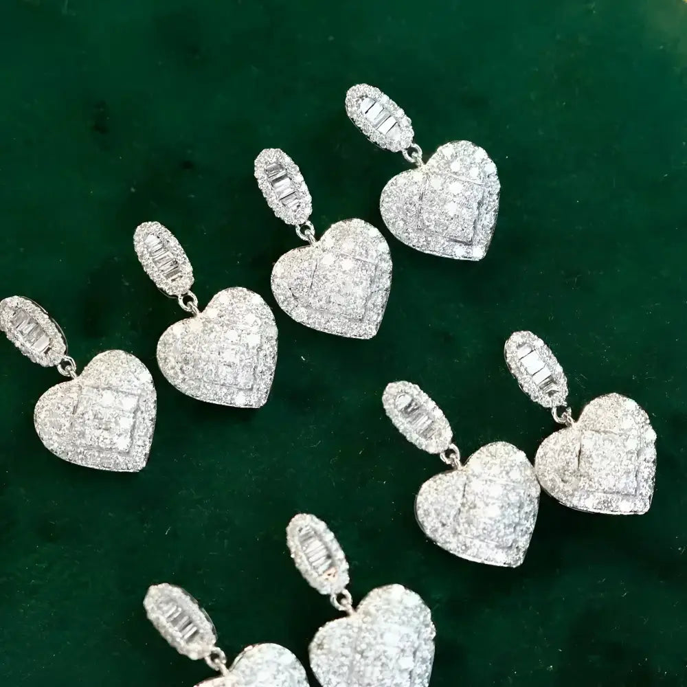 Sparkling heart-shaped diamond earrings.