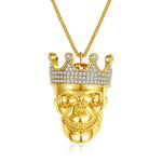 Gold skull pendant with jeweled crown.