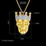 Gold skull pendant with crown.