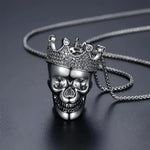 Silver skull pendant with crown.