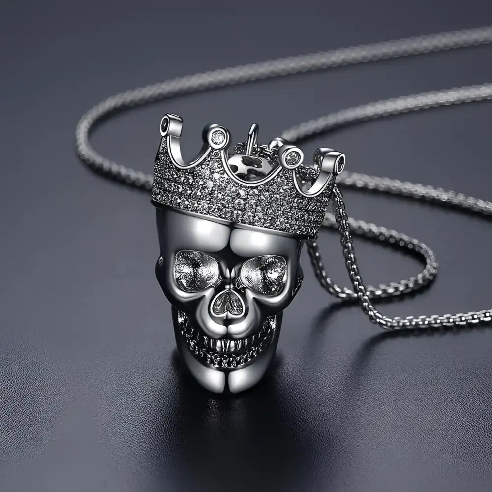 Silver skull pendant with crown.