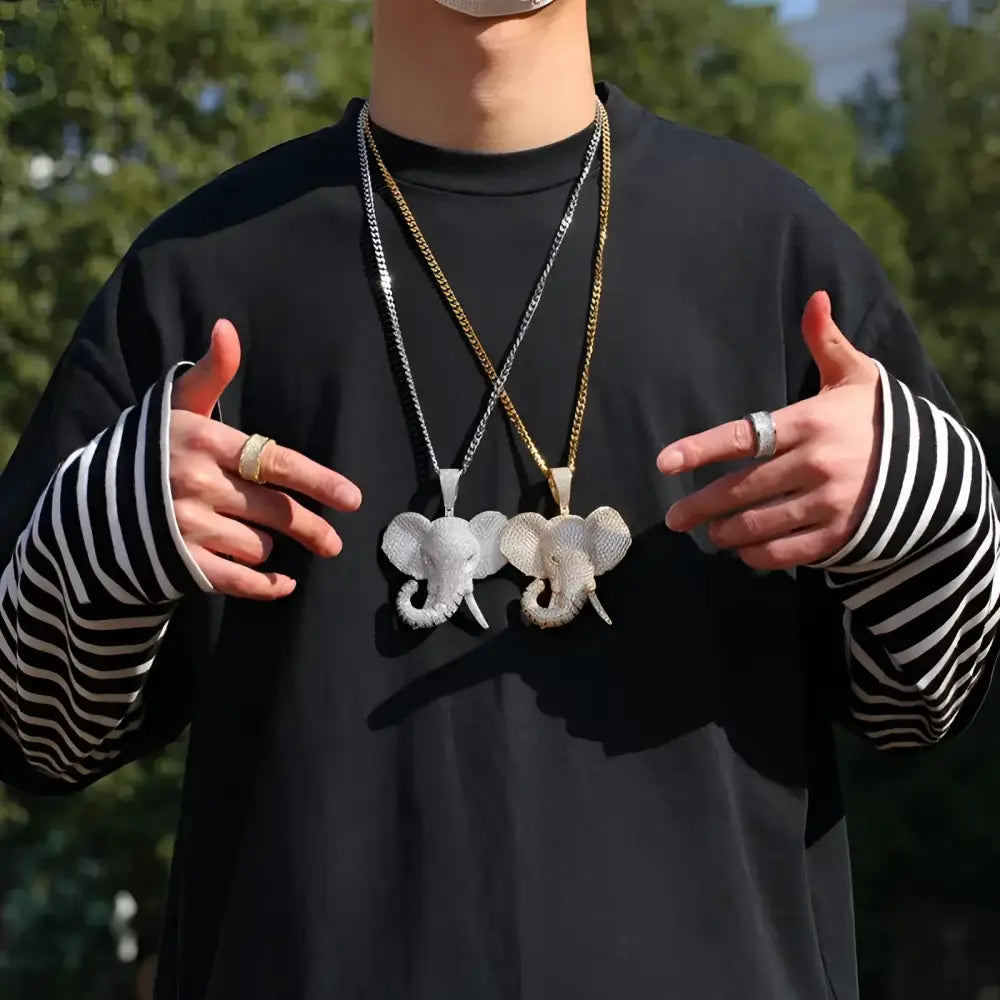 Two elephant pendant necklaces.