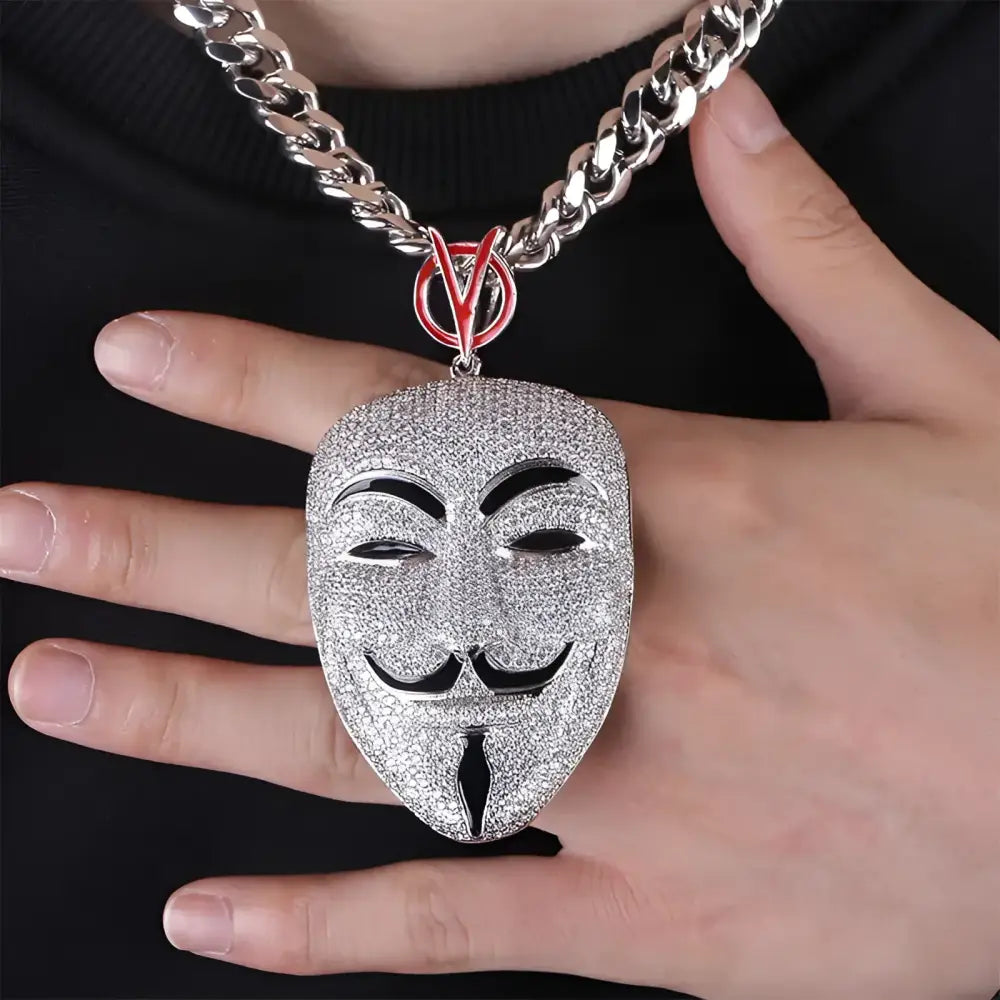 Sparkly Guy Fawkes mask pendant.