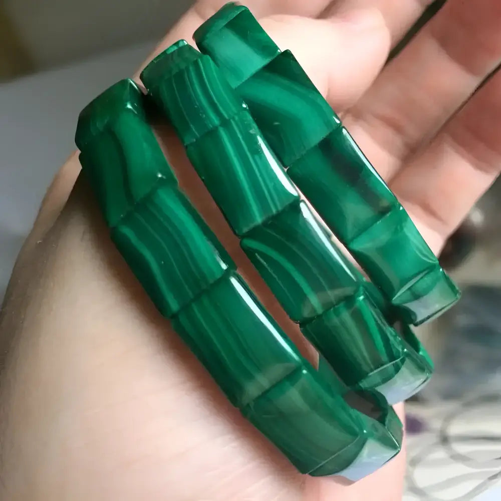 Three green malachite bracelets.