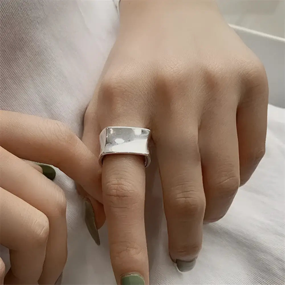 Silver statement ring.