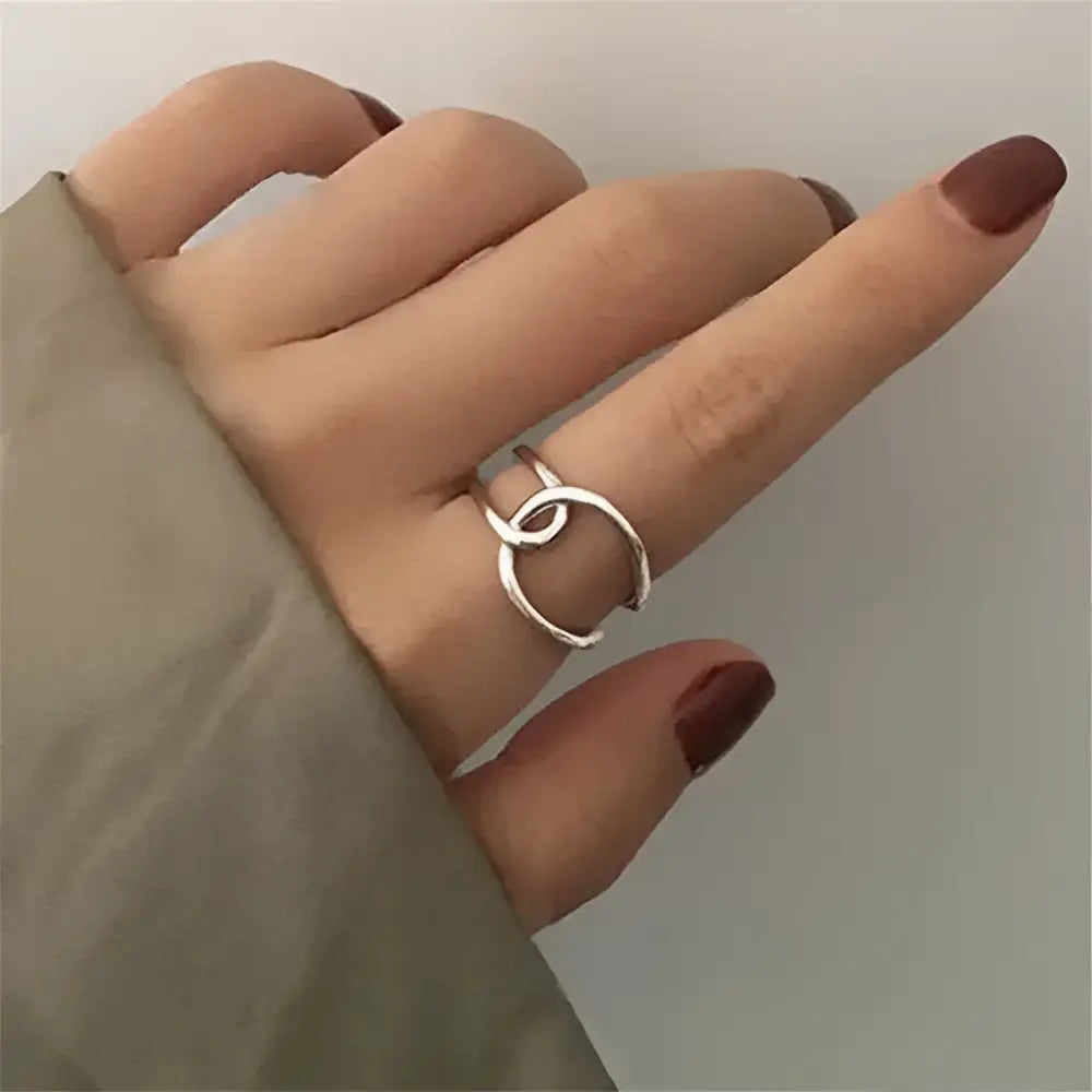 Silver interlocking circle ring.