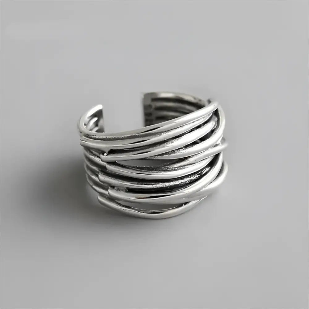 Oxidized silver multi-strand ring.