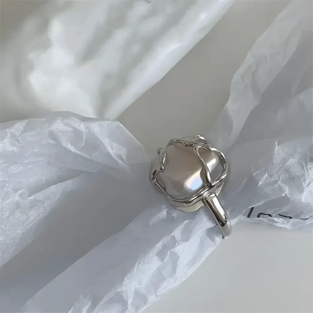 Silver ring with baroque pearl.