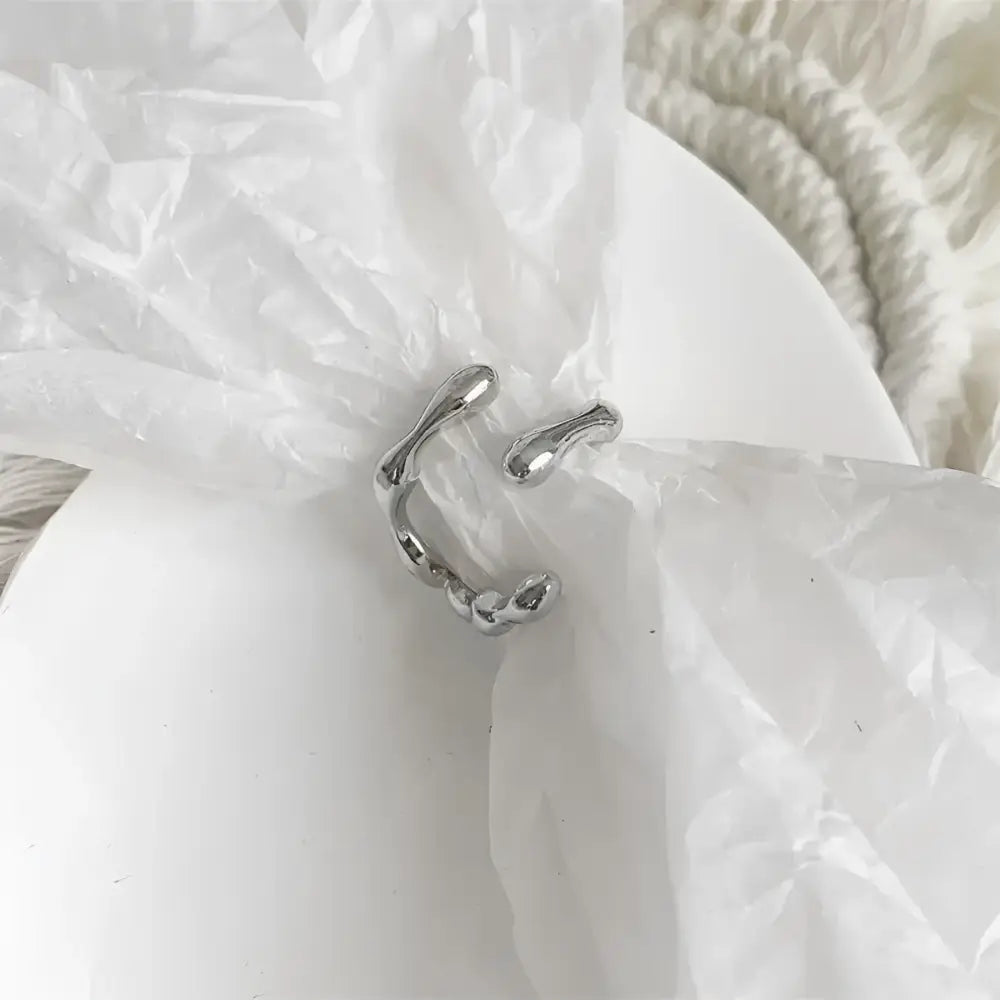 Silver abstract ring.