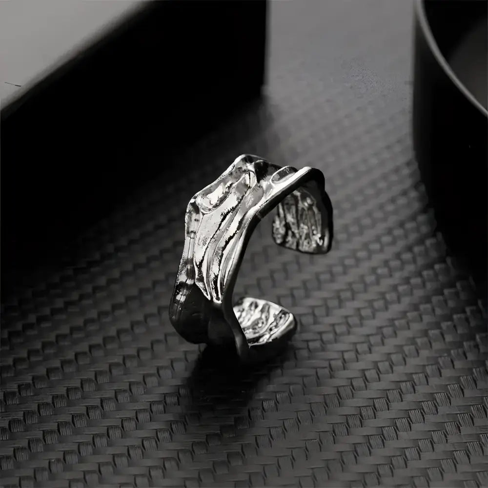 Textured silver ring.