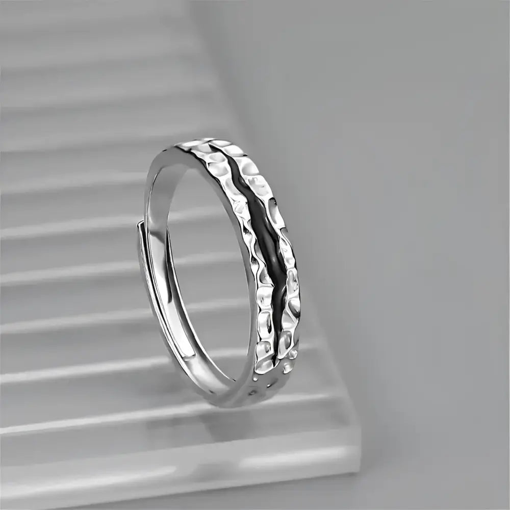Silver hammered-texture ring.