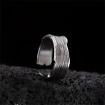 Textured silver ring.