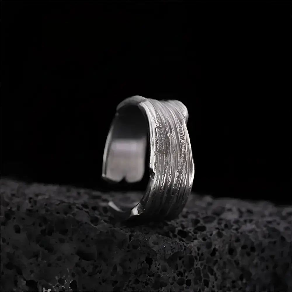 Textured silver ring.