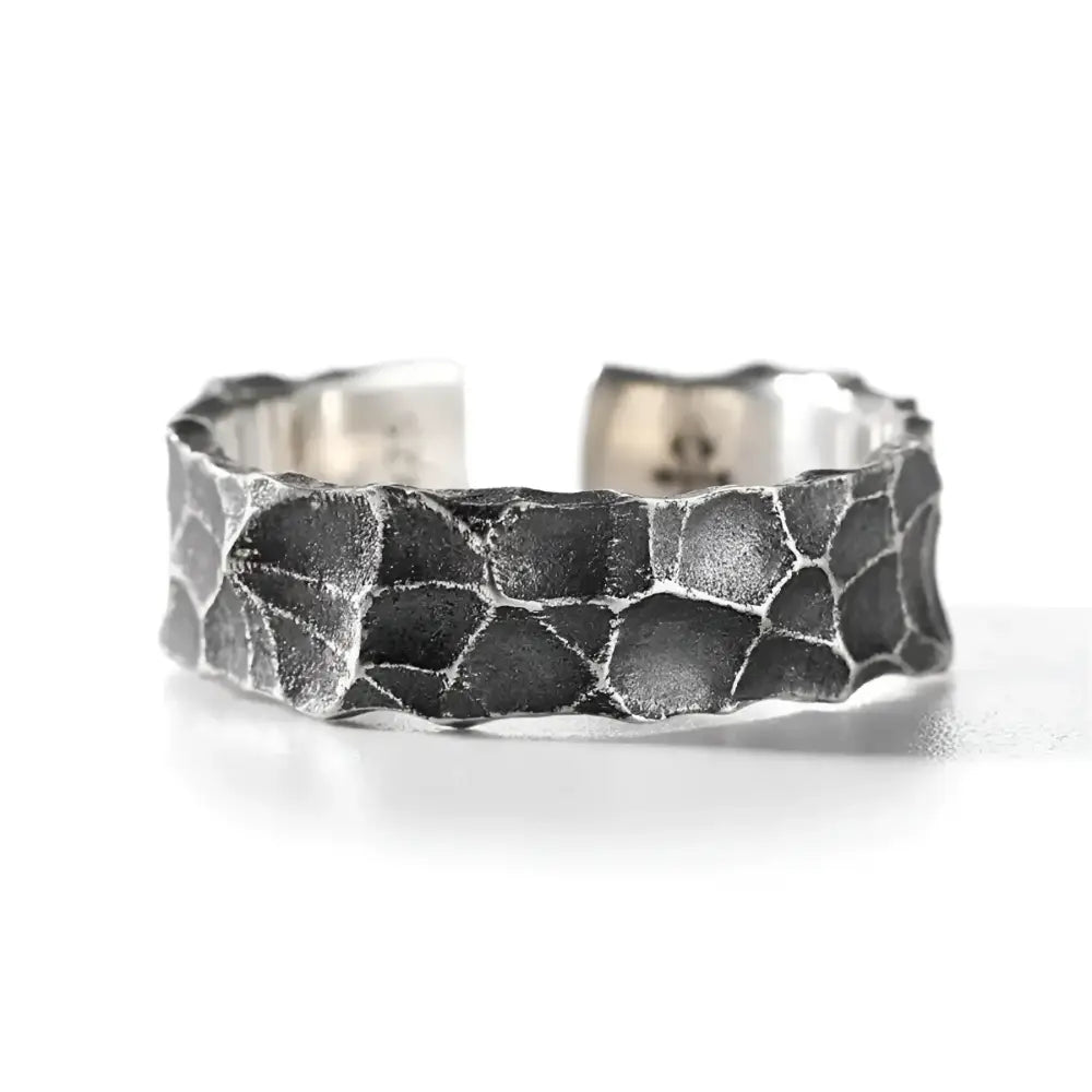 Textured silver ring.