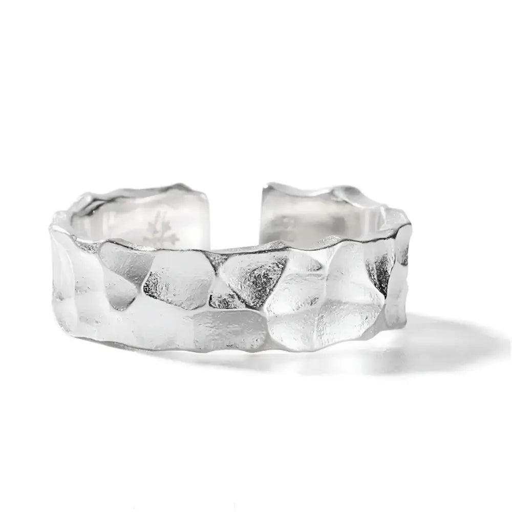 Textured silver ring.