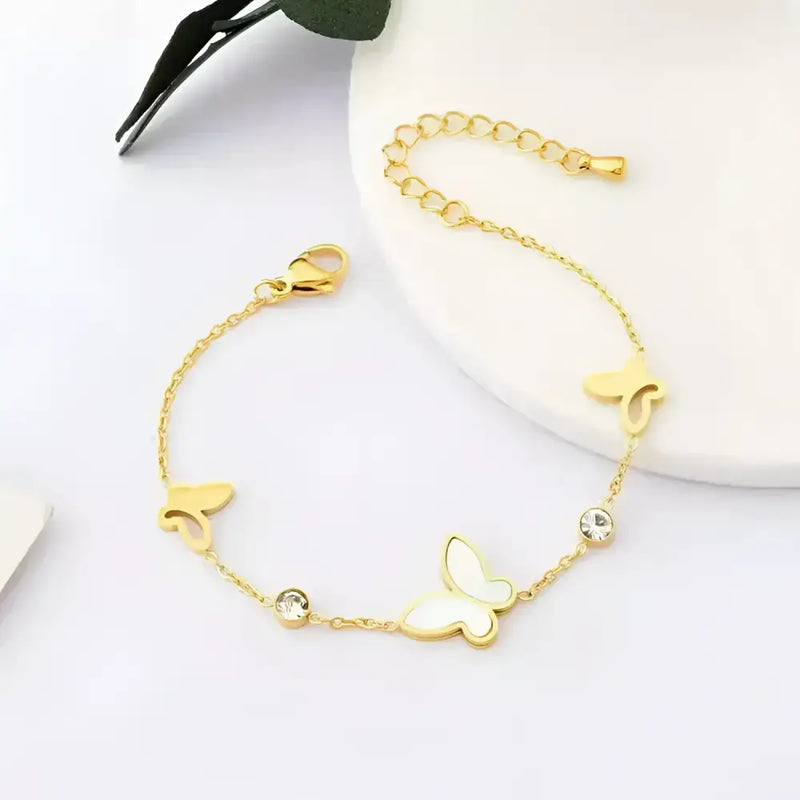 Gold butterfly charm bracelet.