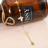 Gold butterfly charm bracelet.