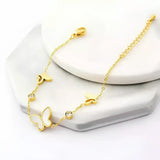 Gold-toned butterfly charm bracelet.