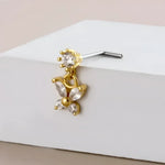 Gold butterfly nose ring.