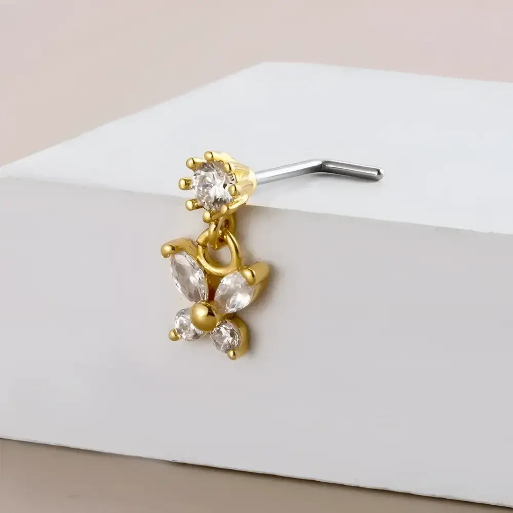 Gold butterfly nose ring.
