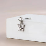Silver butterfly nose ring.
