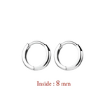 Pair of silver hoop earrings.
