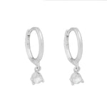 Pair of silver hoop earrings with teardrop pendants.