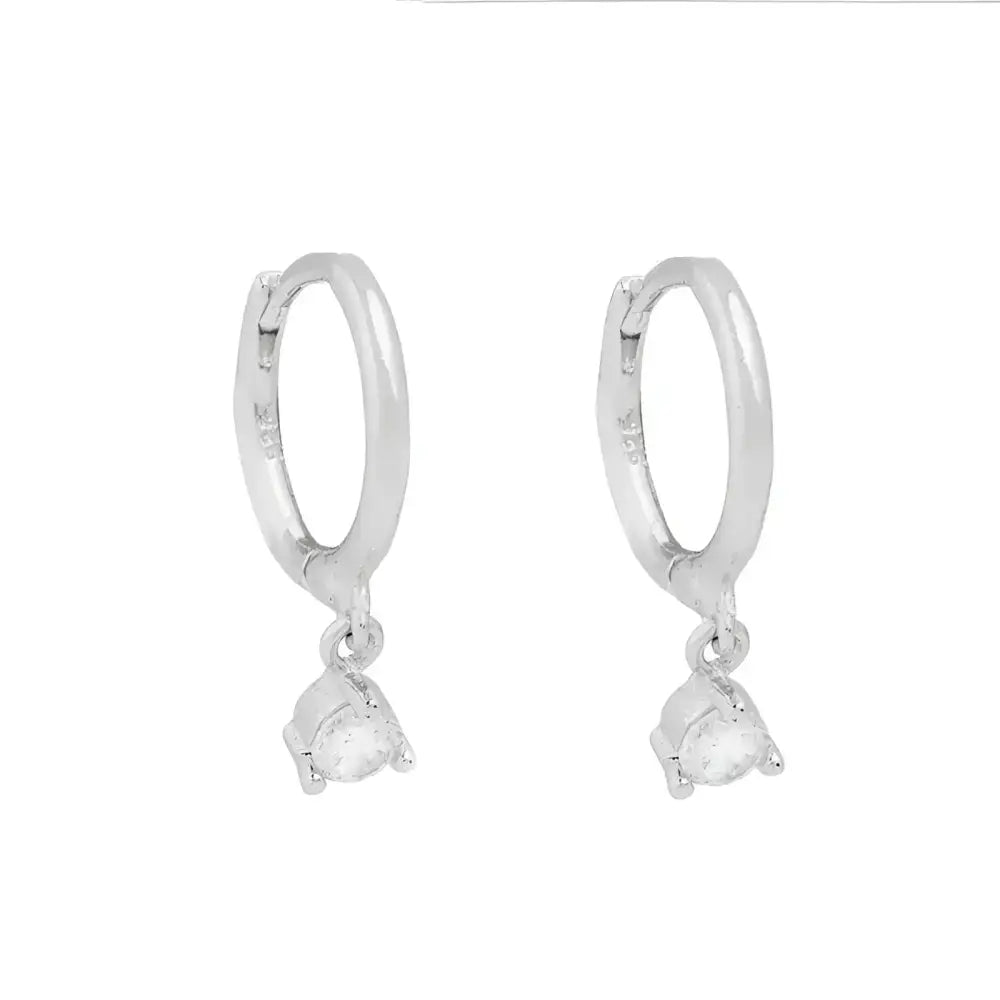 Pair of silver hoop earrings with teardrop pendants.