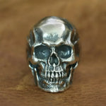 Silver skull ring.