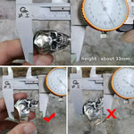 Silver skull ring with measurement.