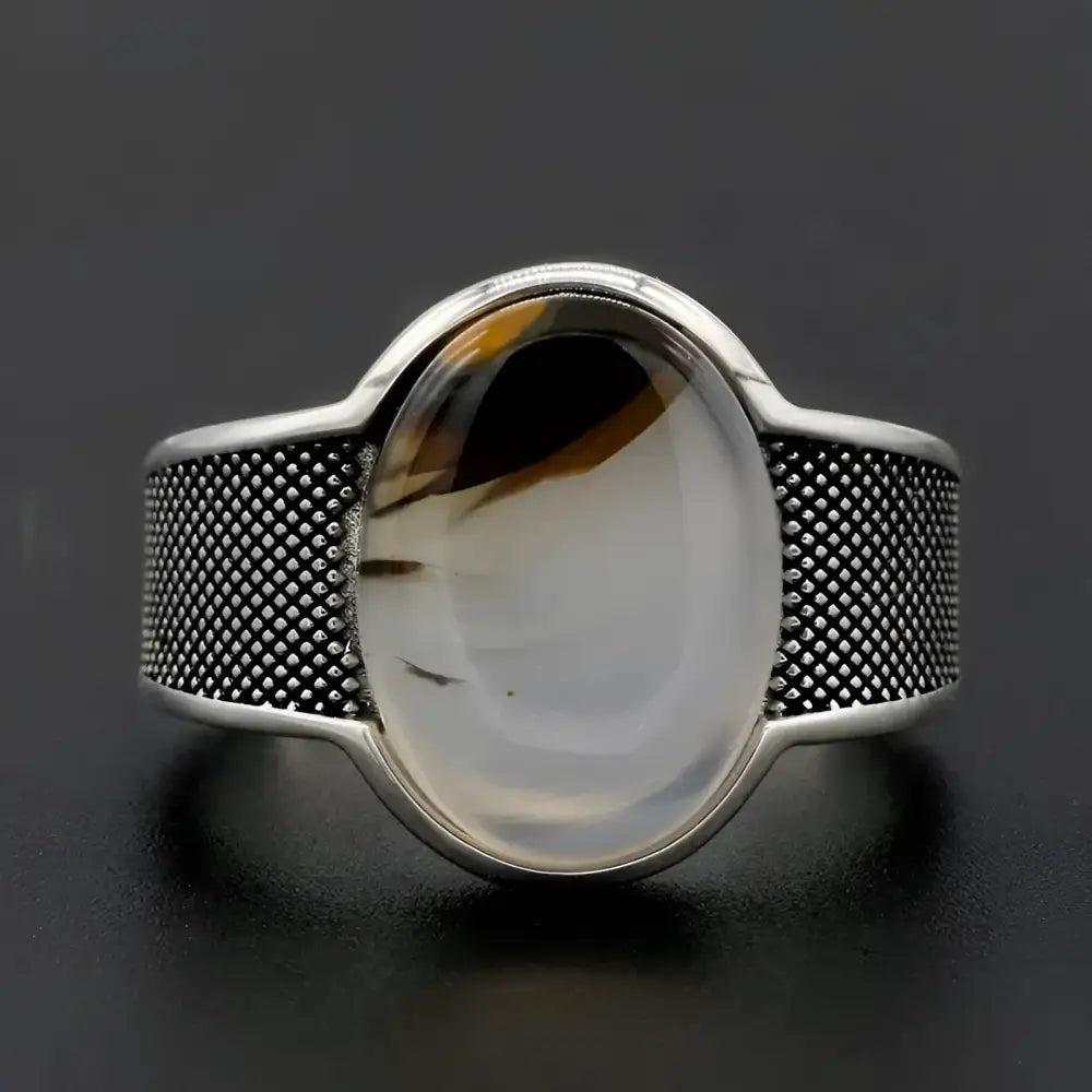 Silver ring with oval stone.