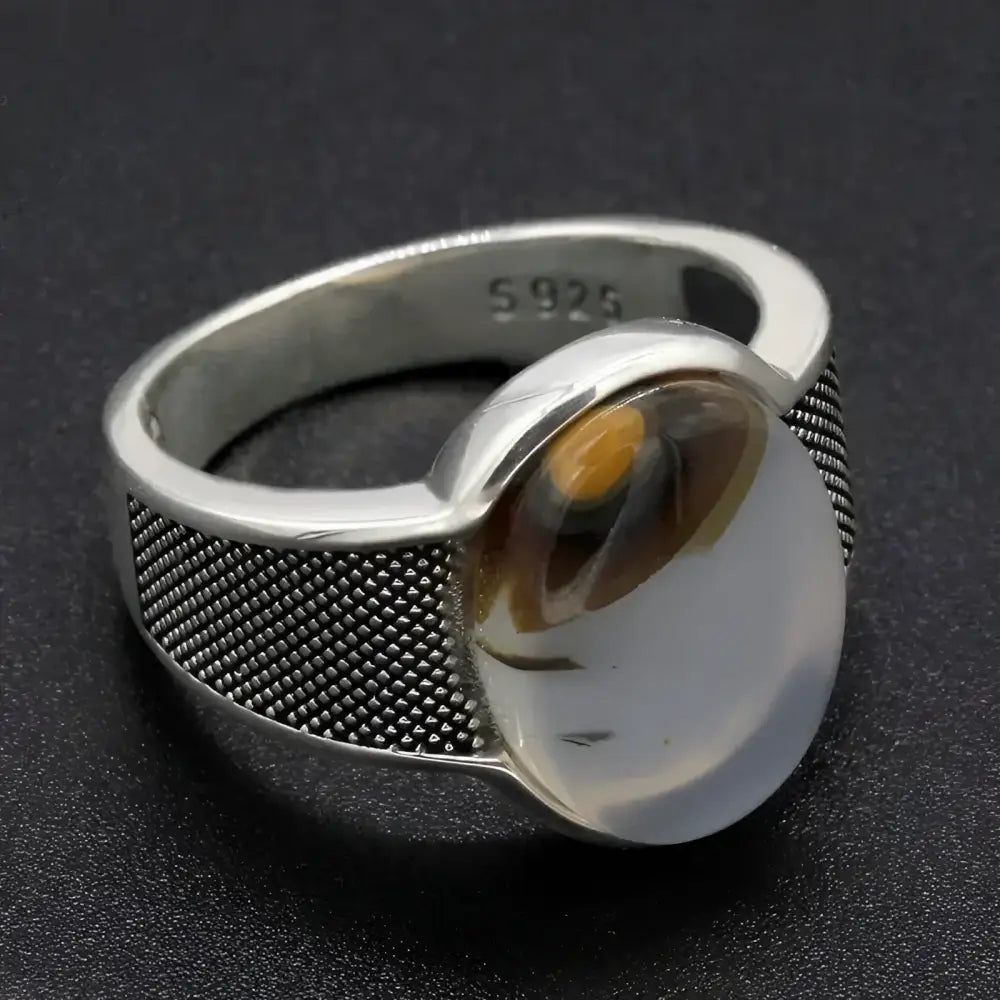 Silver ring with translucent stone.