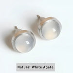Pair of white agate stud earrings.