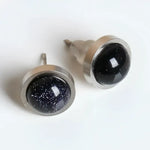 Pair of blue goldstone stud earrings.