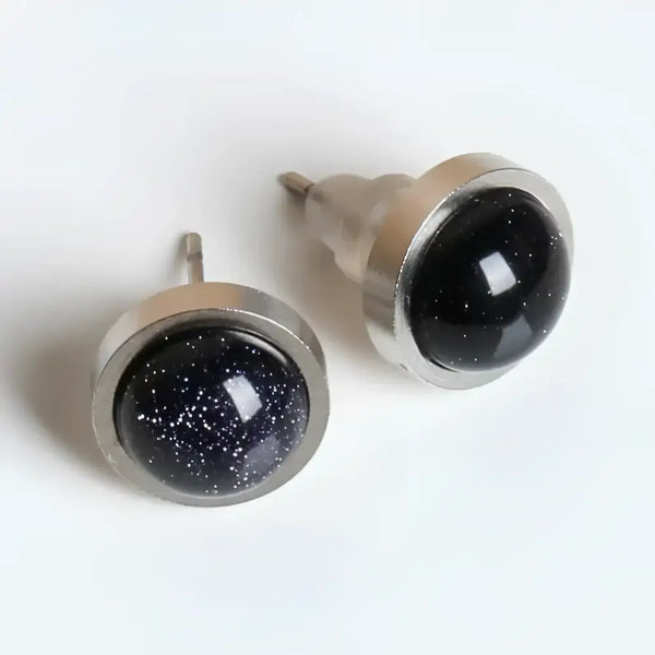 Pair of blue goldstone stud earrings.
