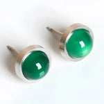 Pair of green gemstone stud earrings.