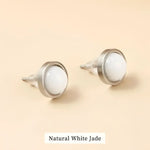 Pair of white jade stud earrings.