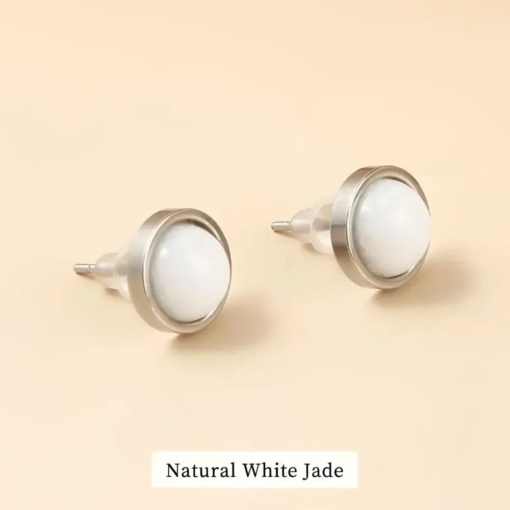 Pair of white jade stud earrings.