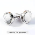 Pair of white turquoise stud earrings.