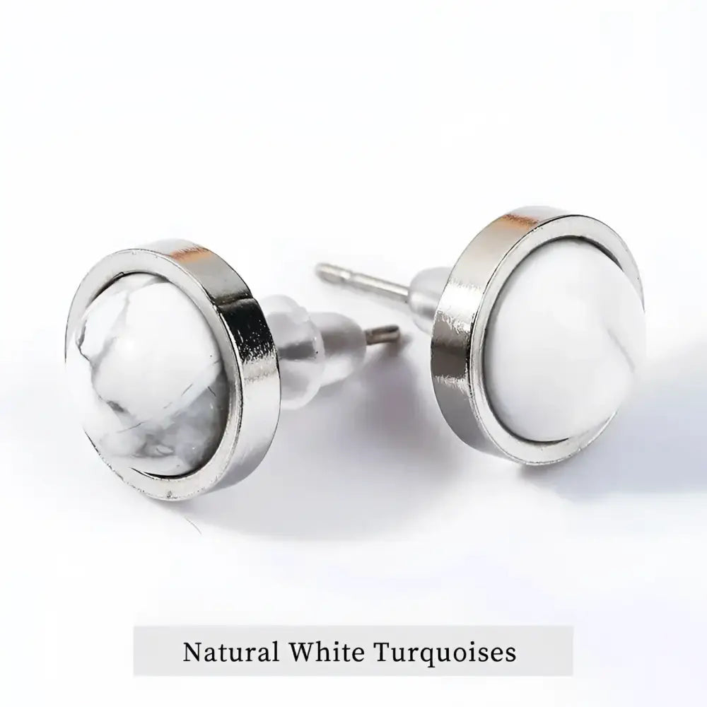 Pair of white turquoise stud earrings.